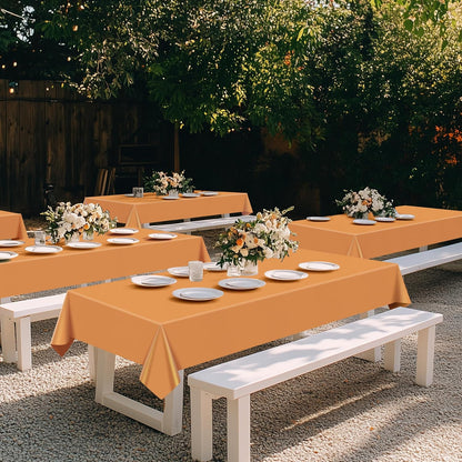 Set of 4 Orange Rectangular Tablecloths, 54x72 Inches, Waterproof and Spillproof Disposable Plastic Covers for Dining, Buffets, Picnics, and Outdoor Events