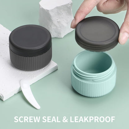 Travel Containers for Toiletries, TSA Approved 1.5 Oz Silicone Cream Jars, Leak-Proof Journey Containers, Trip Accessories with Lid for Cosmetic Face Hand Body Cream 4 Pack Black Lid - Grey