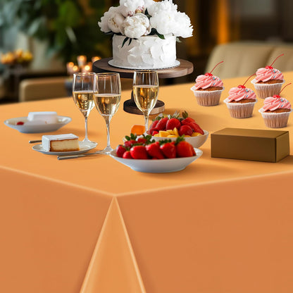 Set of 4 Orange Rectangular Tablecloths, 54x72 Inches, Waterproof and Spillproof Disposable Plastic Covers for Dining, Buffets, Picnics, and Outdoor Events